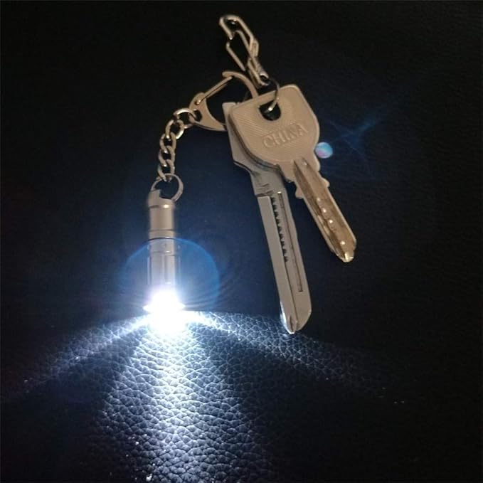 e1 The World's Smallest Flashlight Micro Tiny Mini Keychain Light Long-Lasting Safety Light for Everyday Carry Emergencies Outdoor Dog Walking Hiking Camping Nice Gift for Parents and Kids.